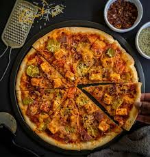 Paneer Tikka Masala Pizza ( onion tomato capsicum and panner tikka masala with cheese )